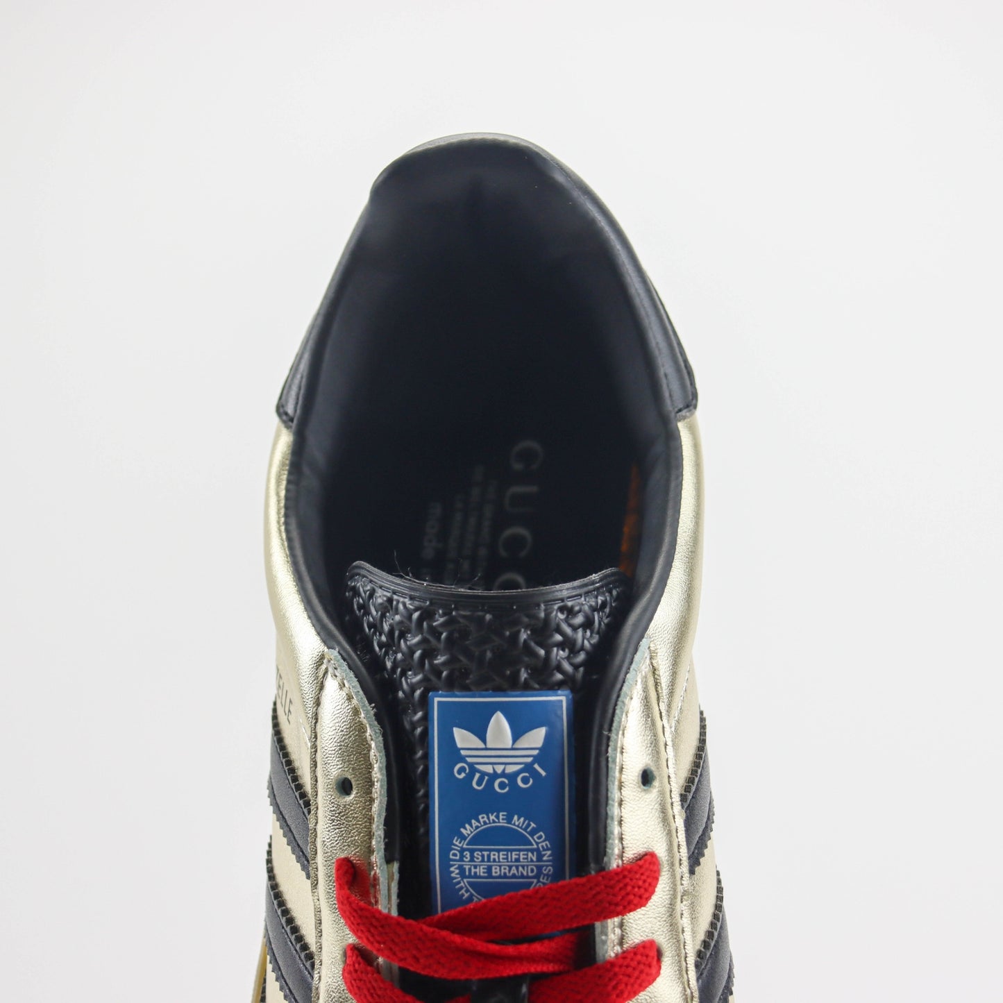 Tenis GG x Ads Gazelle Dourado com vermelho