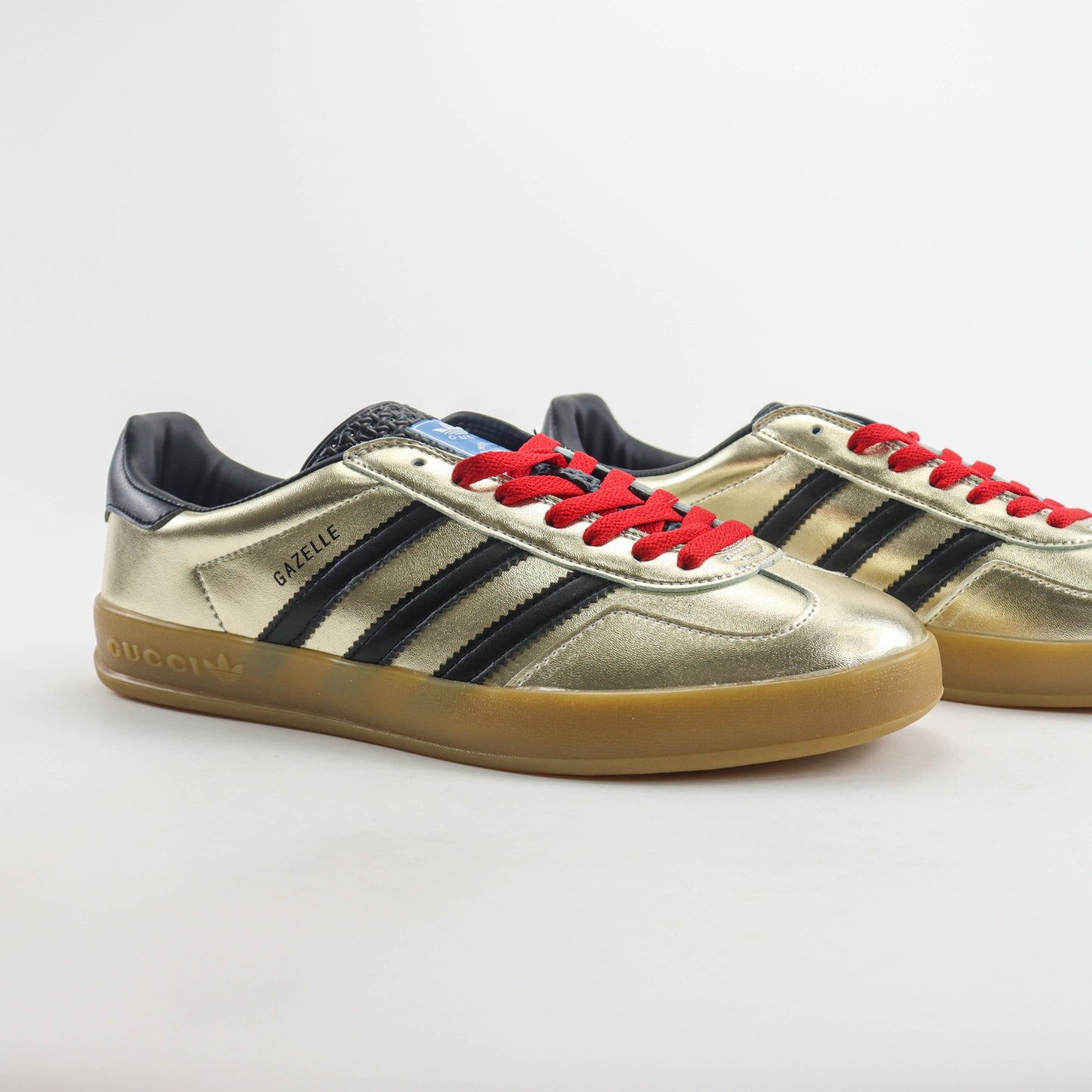 Tenis GG x Ads Gazelle Dourado com vermelho